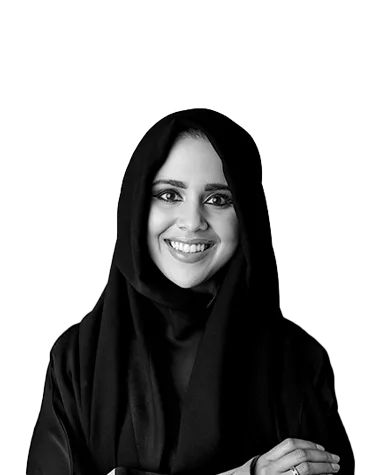 Smiling woman, looking confident in a professional portrait, black and white photo.