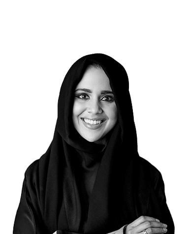 Smiling woman, looking confident in a professional portrait, black and white photo.
