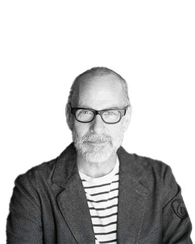 Portrait of a confident older man with glasses in a striped shirt