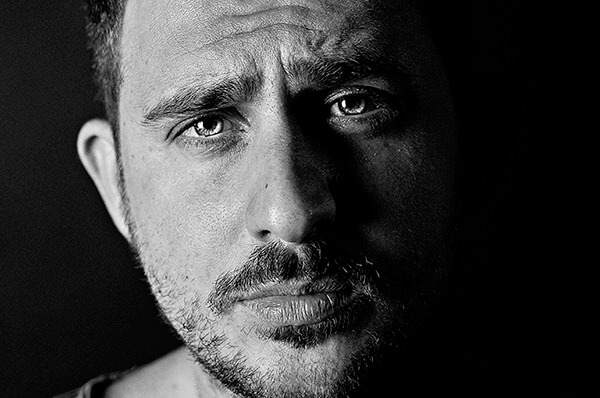 Close-up portrait of a thoughtful man in black and white Close-up portrait of a thoughtful man in black and white